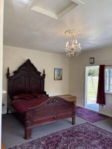 A stunning antique-styled Queen Bed for luxurious sleeping