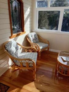 The heat-soaked sunroom of Lily's Cottage