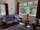 Leather couch by the window offering beautiful river views